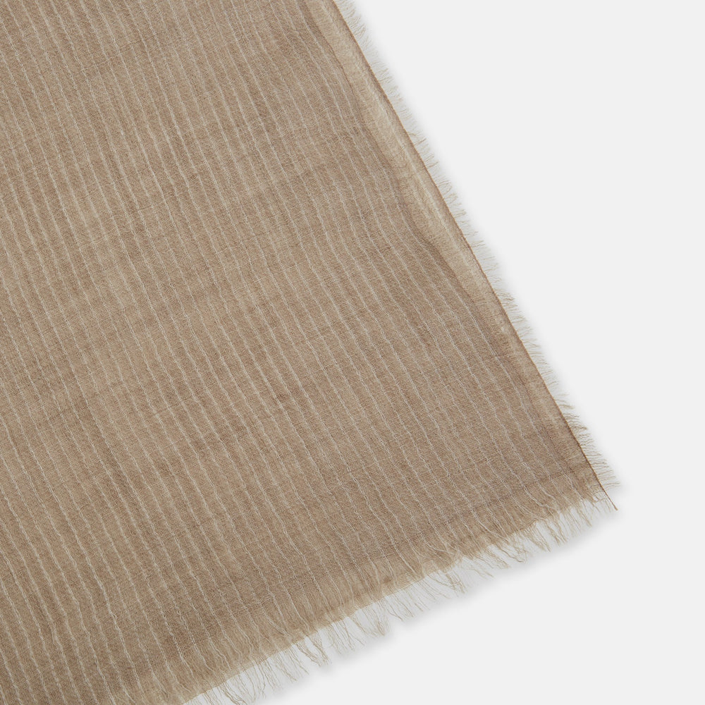 A Turnbull & Asser Beige and White Striped Cashmere Scarf, featuring a subtle pattern and fringed edge, is neatly folded and knotted against a plain white background.