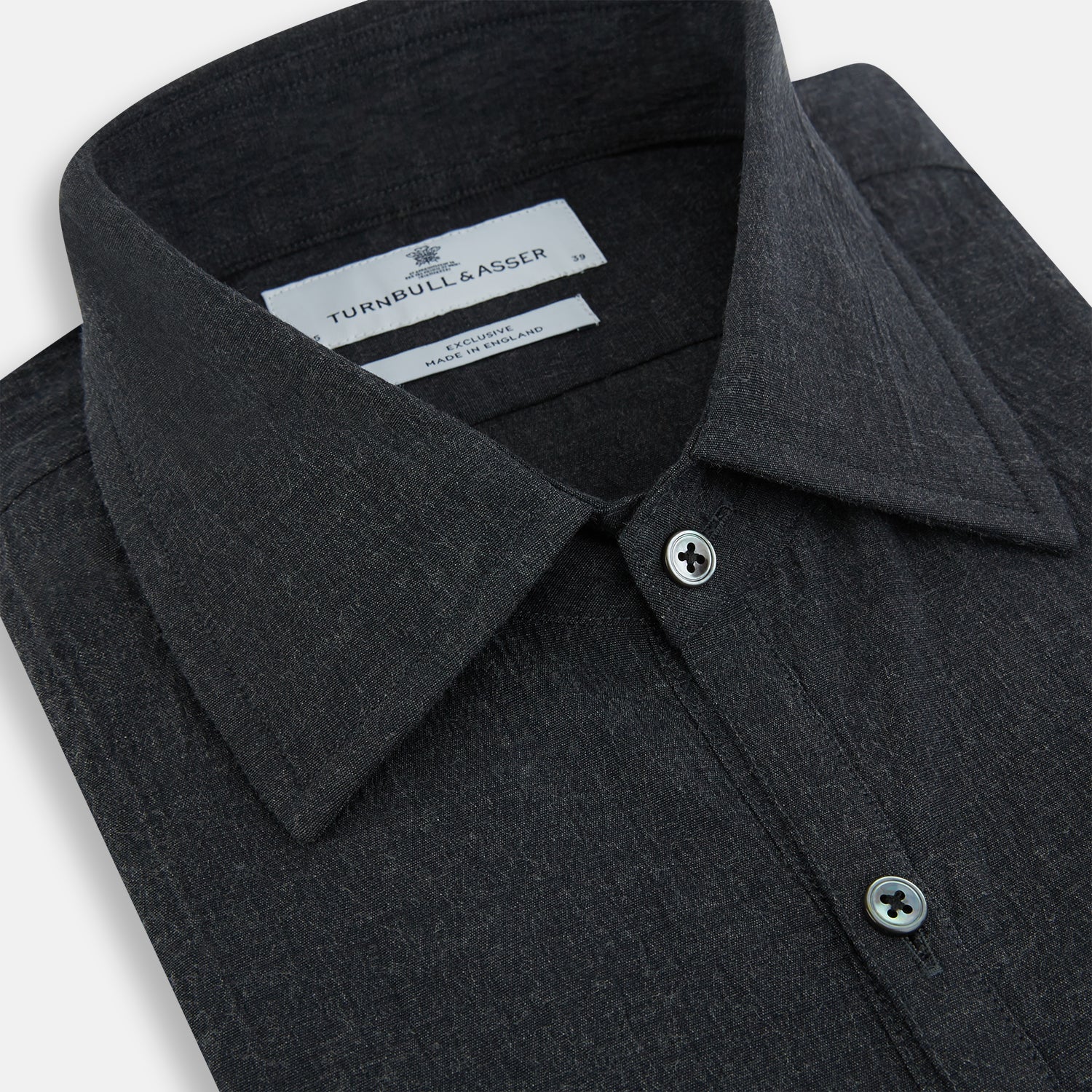 View 2 of product The Turnbull & Asser Midnight Blue Westminster Shirt features long sleeves, a button-up front, classic collar, and buttoned cuffs in a plain design—showcasing British craftsmanship—laid flat on a white background.