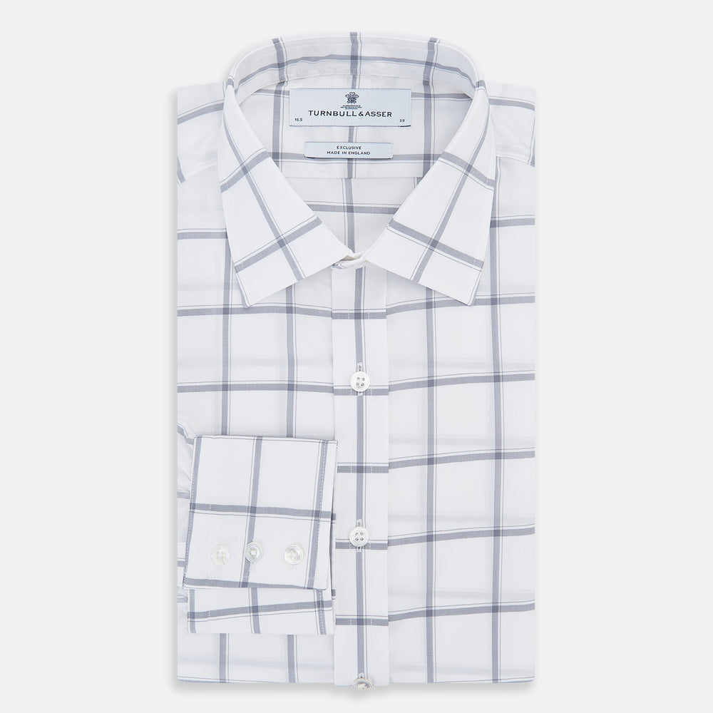 The Turnbull & Asser Grey Grid Check Mayfair Shirt features a classic collar and buttoned cuffs, crafted from fine Italian cotton with a grey grid check on white, and is shown against a plain white background.