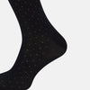View 4 of product A single Navy/Pale Blue Polka Dot Long Sock by Turnbull & Asser, made from mercerised Egyptian cotton, is displayed against a plain white background.