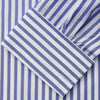 View 4 of product The Turnbull & Asser Pale Blue Candy Stripe Cotton Marlene Shirt is an oversized women's collared shirt with long sleeves, buttoned cuffs, and vertical blue and white stripes, shown laid flat on a white background.
