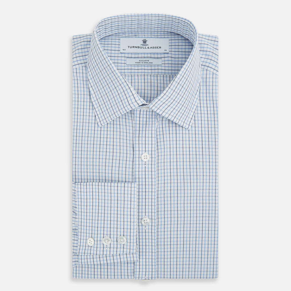 The Turnbull & Asser Navy and Blue Multi Check Mayfair Shirt features a T&A collar, button cuffs, and a blue checkered pattern. This long-sleeve, button-up shirt is shown on a white background.