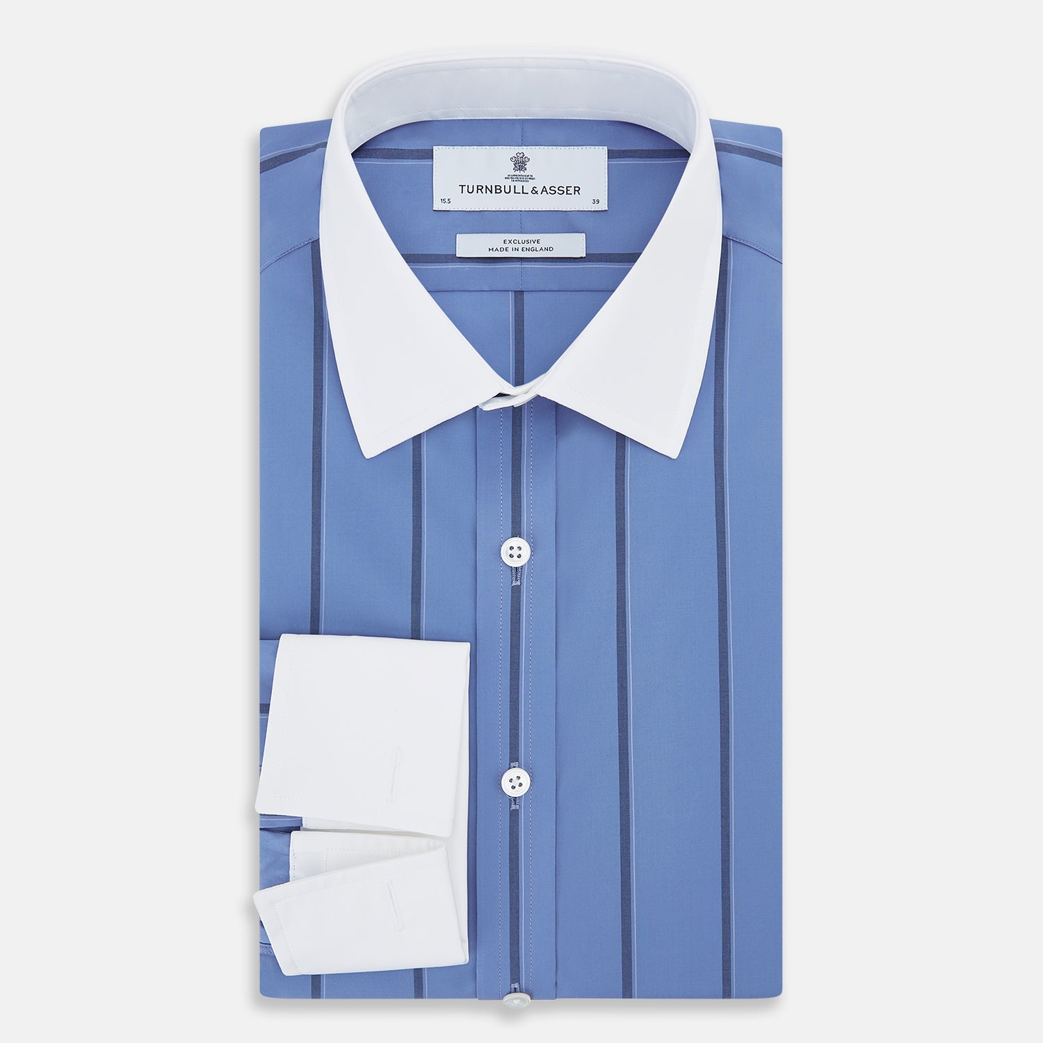 View 5 of product The Turnbull & Asser Colony Blue Track Stripe Shirt features vertical dark blue stripes, a Mayfair fit, and contrast white T&A collar and cuffs, reflecting British craftsmanship against a plain light background.