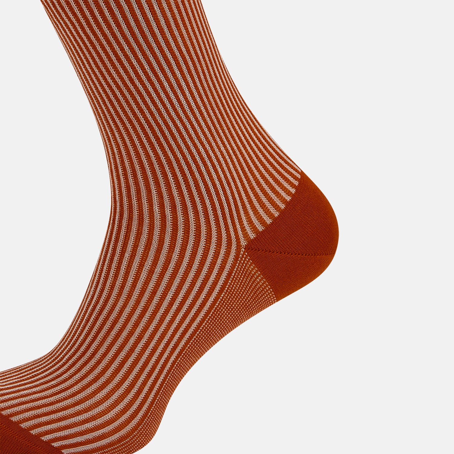 View 4 of product Turnbull & Asser's Rust/White Thin Striped Long Socks feature thin vertical stripes with a solid burnt orange cuff, heel, and toe. A single over-the-calf sock displayed on white background—ideal for those seeking stylish long socks.