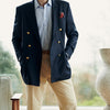 View 6 of product The Classic Navy Wool Blazer by Turnbull & Asser features a double-breasted design, gold buttons, notched lapels, and multiple front pockets, shown on a white background. This piece offers timeless, sophisticated nautical style.