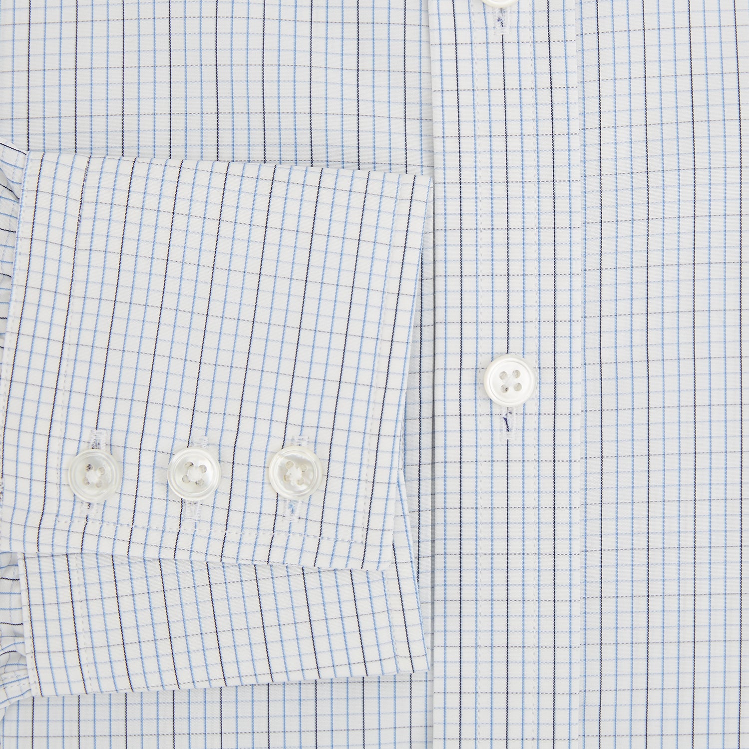 View 4 of product The Turnbull & Asser Pale Blue and Navy Grid Check Mayfair Shirt is a long-sleeve, button-up shirt made from fine Italian cotton, featuring a pointed collar and buttoned cuffs, shown against a plain white background.
