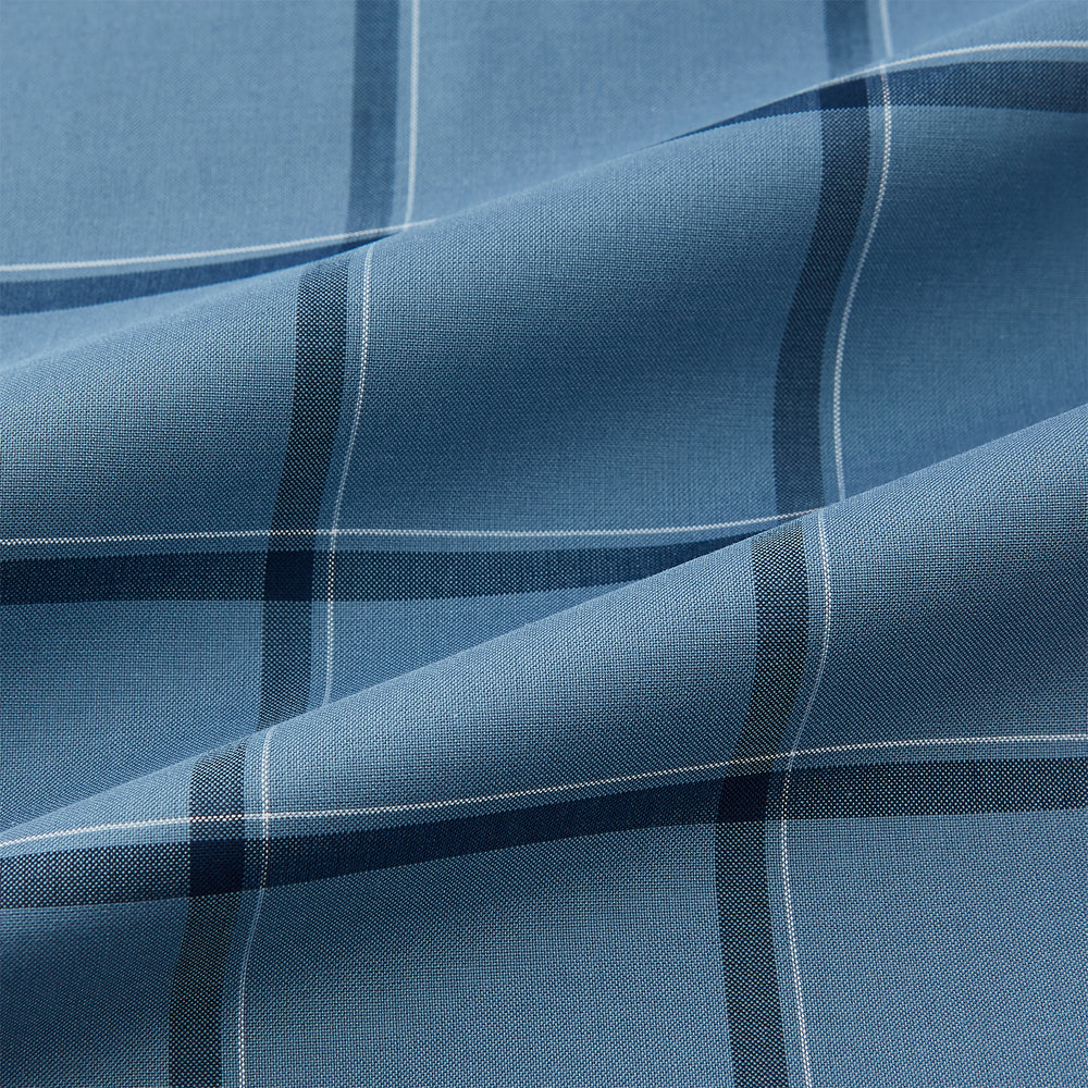 The Turnbull & Asser Steel Grey Grid Check Mayfair Shirt is a long-sleeve, button-up shirt in light blue Italian cotton, shown against a plain white background.