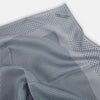View 7 of product The Turnbull & Asser Grey Dot Silk Pocket Square features a light gray silk design with navy polka dots and a solid border. Elegantly handmade, it is shown with one corner folded to display both sides.
