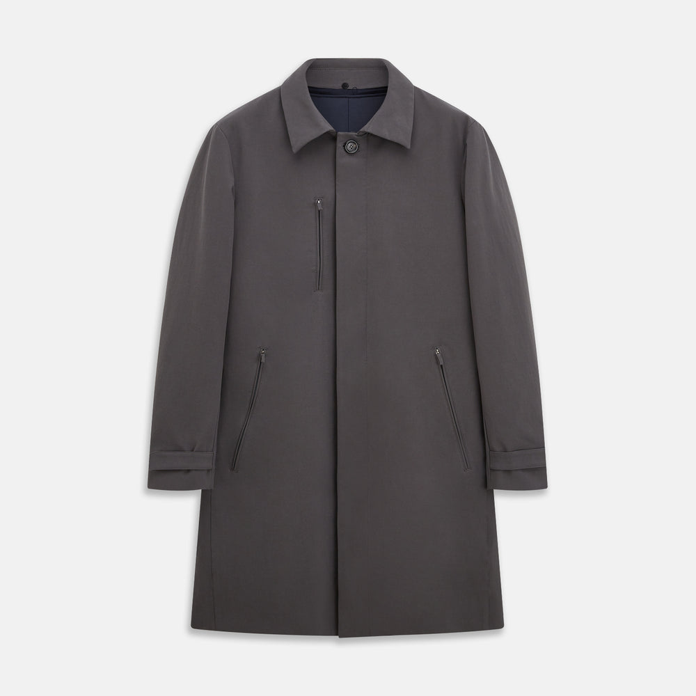 The Turnbull & Asser Charcoal Melange John Arthur Trench Coat, featuring a collar, single-breasted closure, and three zippered pockets—one chest and two at the hips—is shown against a plain white background.