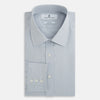View 5 of product The Dove Grey Mayfair Shirt by Turnbull & Asser is a long-sleeve button-up with a collar, front pocket, and white buttons, crafted from soft sanforised cotton and laid flat on a white background.