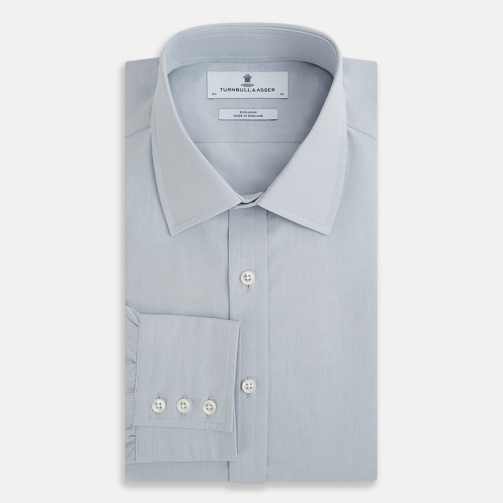 The Dove Grey Mayfair Shirt by Turnbull & Asser is a long-sleeve button-up with a collar, front pocket, and white buttons, crafted from soft sanforised cotton and laid flat on a white background.