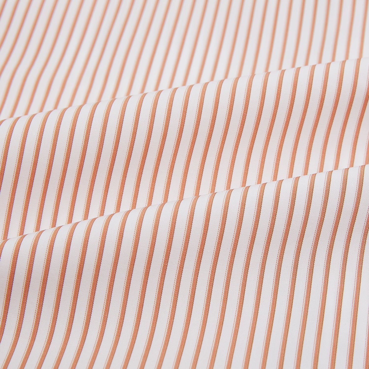 View 8 of product The Orange Multi Stripe Westminster Shirt by Turnbull & Asser features thin vertical orange and white stripes, a Turnbull collar, and long sleeves, elegantly displayed flat against a white background.