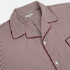 View 2 of product The Turnbull & Asser Burgundy Micro Check Winston Long Nightshirt is knee-length with long sleeves, brown and white micro checks, a collar, chest pocket with piping, and a front button placket.