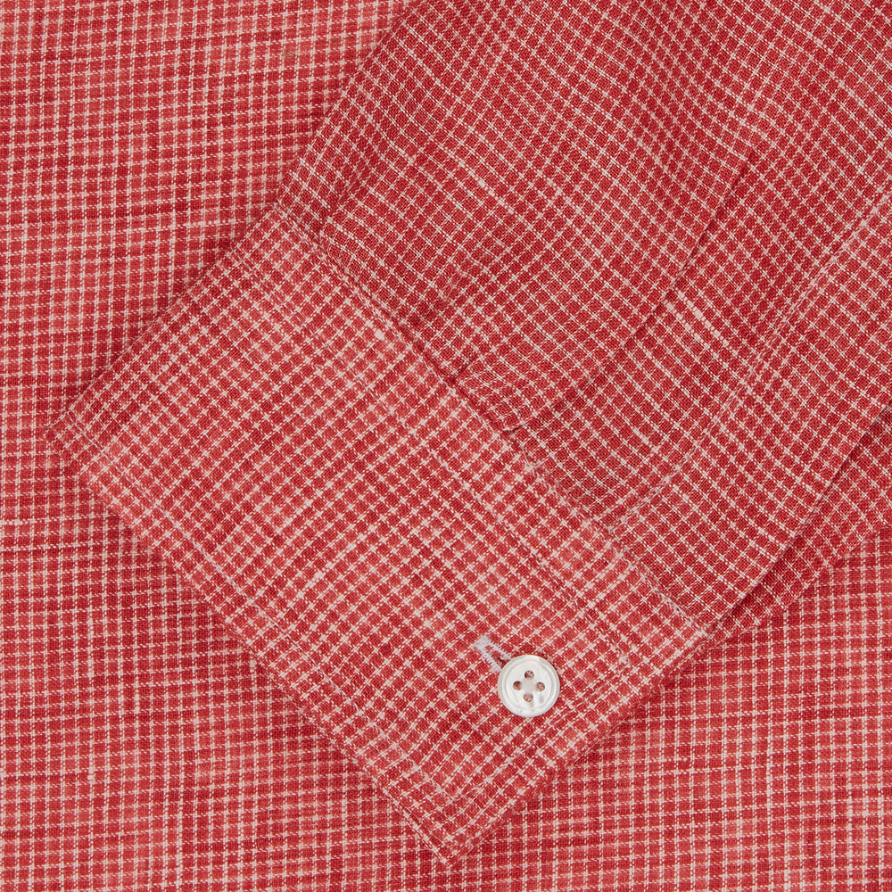 The Turnbull & Asser Weekend Fit Red Check Linen Shirt features a Derby collar, long sleeves with 1-button cuffs, and a single chest pocket—ideal for summer style. Shown against a plain white background.