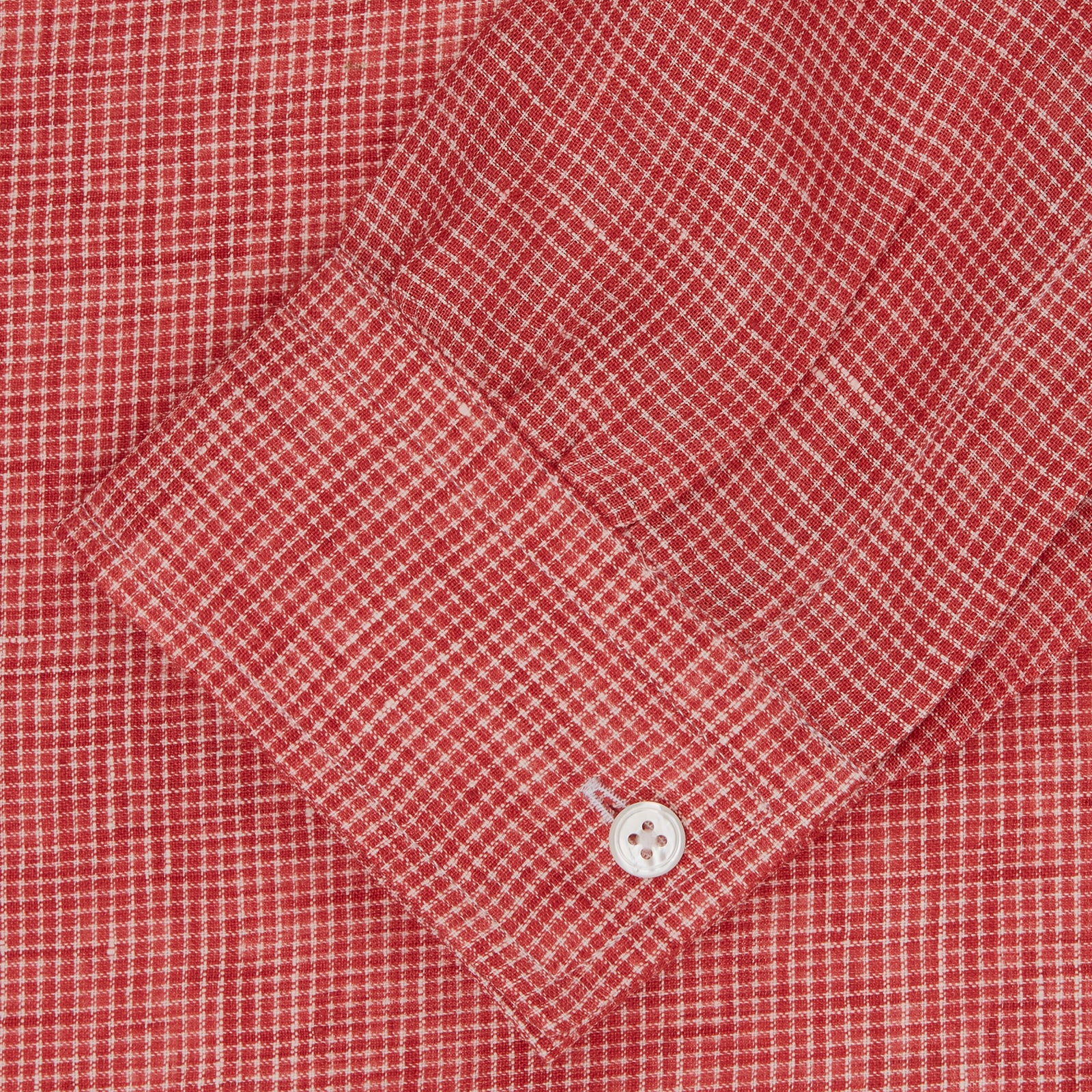 View 2 of product The Turnbull & Asser Weekend Fit Red Check Linen Shirt features a Derby collar, long sleeves with 1-button cuffs, and a single chest pocket—ideal for summer style. Shown against a plain white background.
