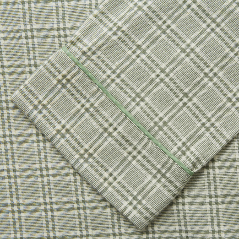 The Turnbull & Asser Green Check Modern Cotton Pyjama Set features a contemporary fit in white and green plaid, made from thicker cotton for added comfort.