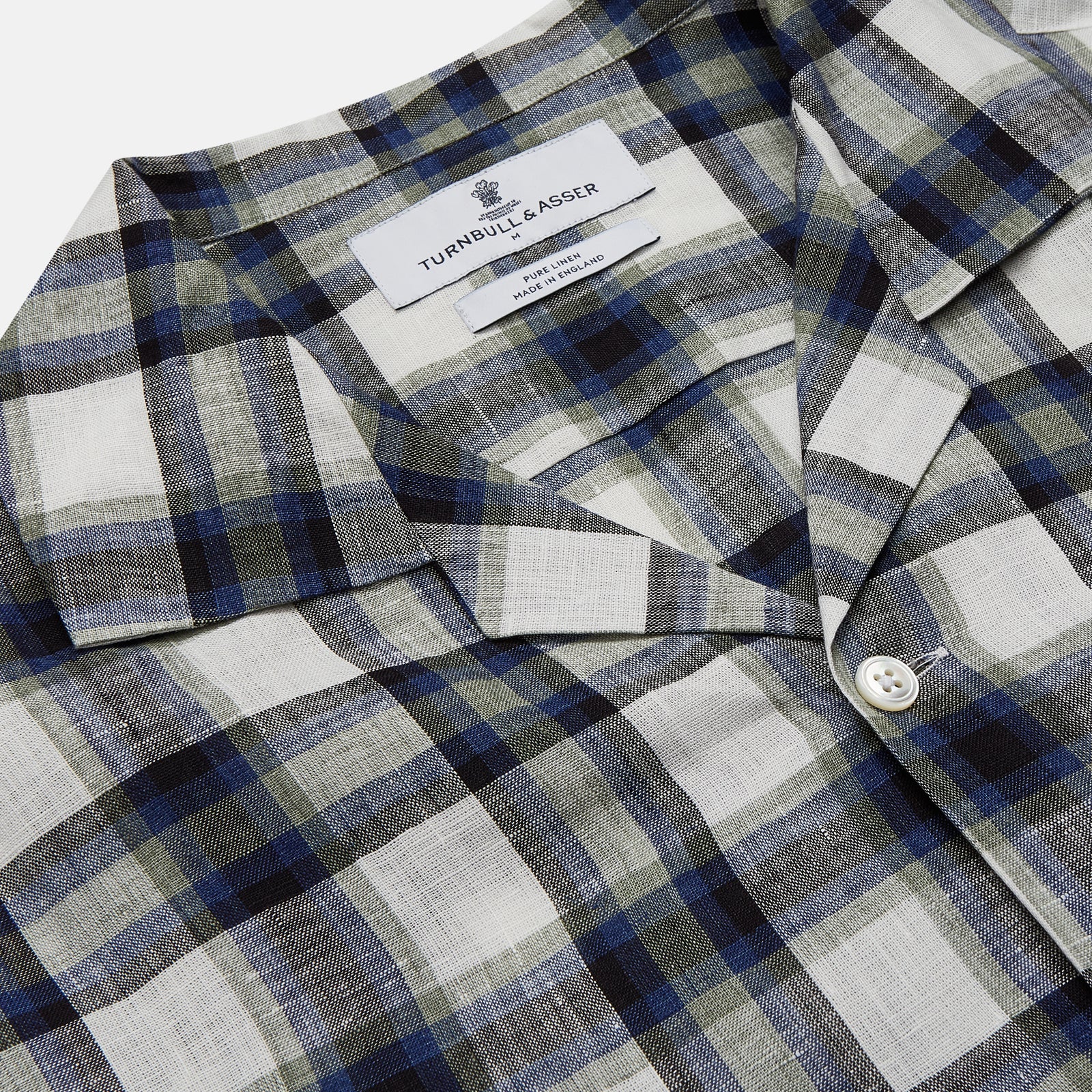 View 4 of product A Green Multi Check Linen Holiday Fit Winnington Shirt by Turnbull & Asser, featuring a check pattern and revere collar, displayed flat on a white background.