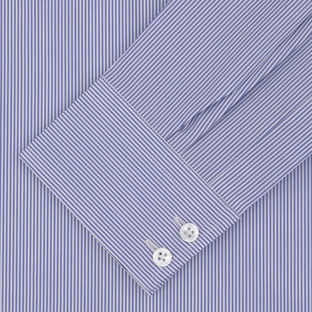 The Turnbull & Asser Tailored Fit Blue Fine Bengal Stripe Shirt features a Kent collar, 2-button cuffs, and is displayed neatly folded on a white background.