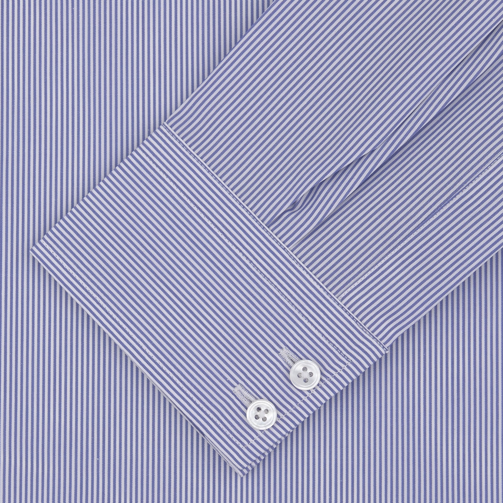 View 2 of product The Turnbull & Asser Tailored Fit Blue Fine Bengal Stripe Shirt features a Kent collar, 2-button cuffs, and is displayed neatly folded on a white background.