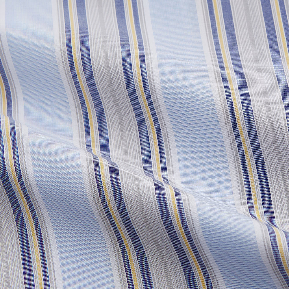 The Turnbull & Asser Pale Blue and Yellow Stripe Cotton Regular Fit Mayfair Shirt is a long-sleeve, button-down formal shirt for men, shown on a plain white background.