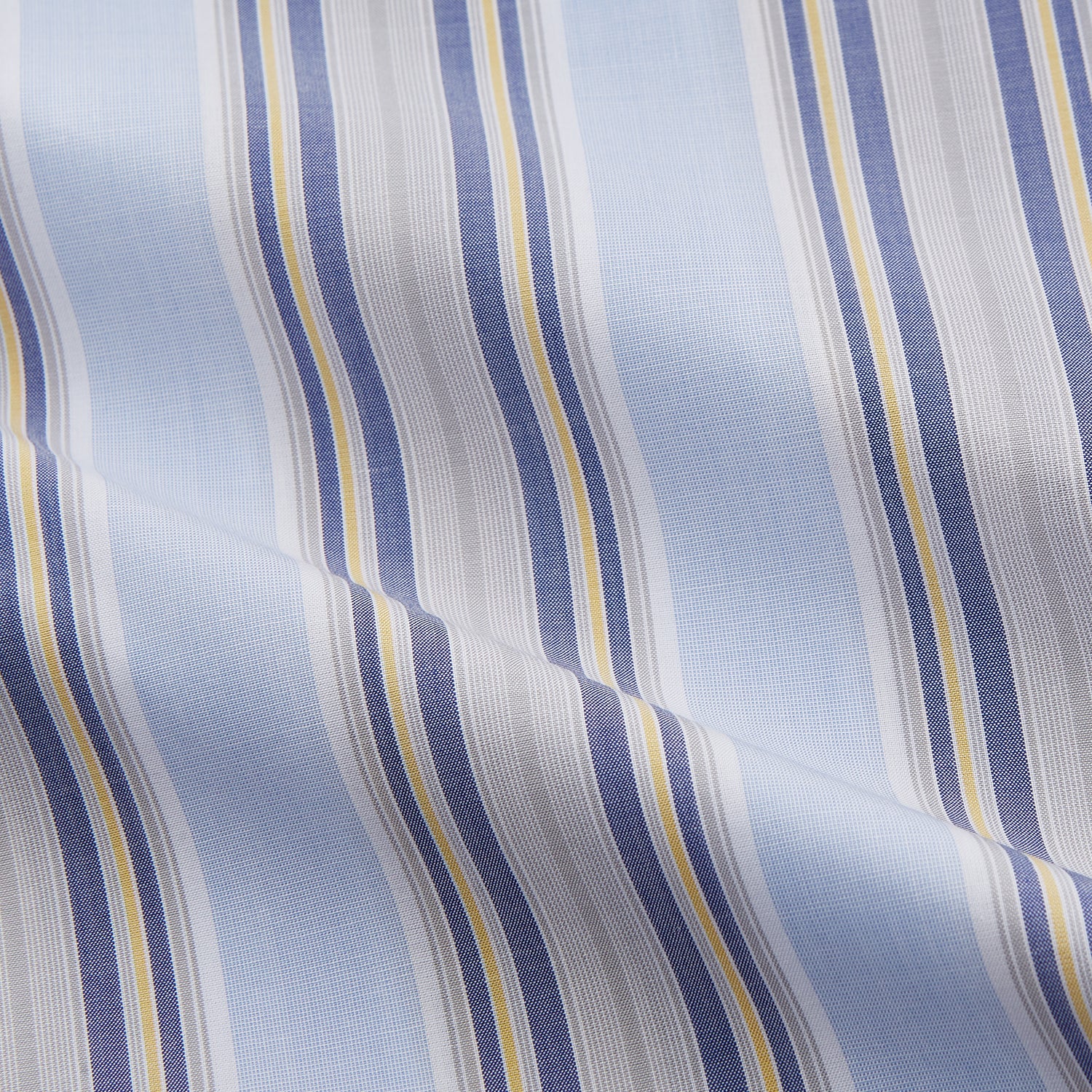 View 4 of product The Turnbull & Asser Pale Blue and Yellow Stripe Cotton Regular Fit Mayfair Shirt is a long-sleeve, button-down formal shirt for men, shown on a plain white background.