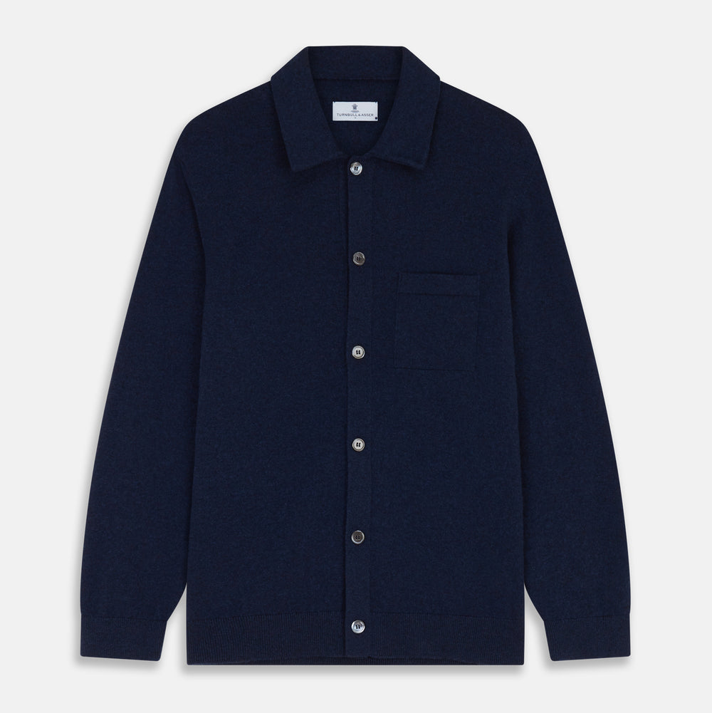 The Turnbull & Asser Navy Cashmere Duncan Knitted Shirt, a button-up with collar, long sleeves, chest pocket, and straight hem, is shown laid flat on a white background.