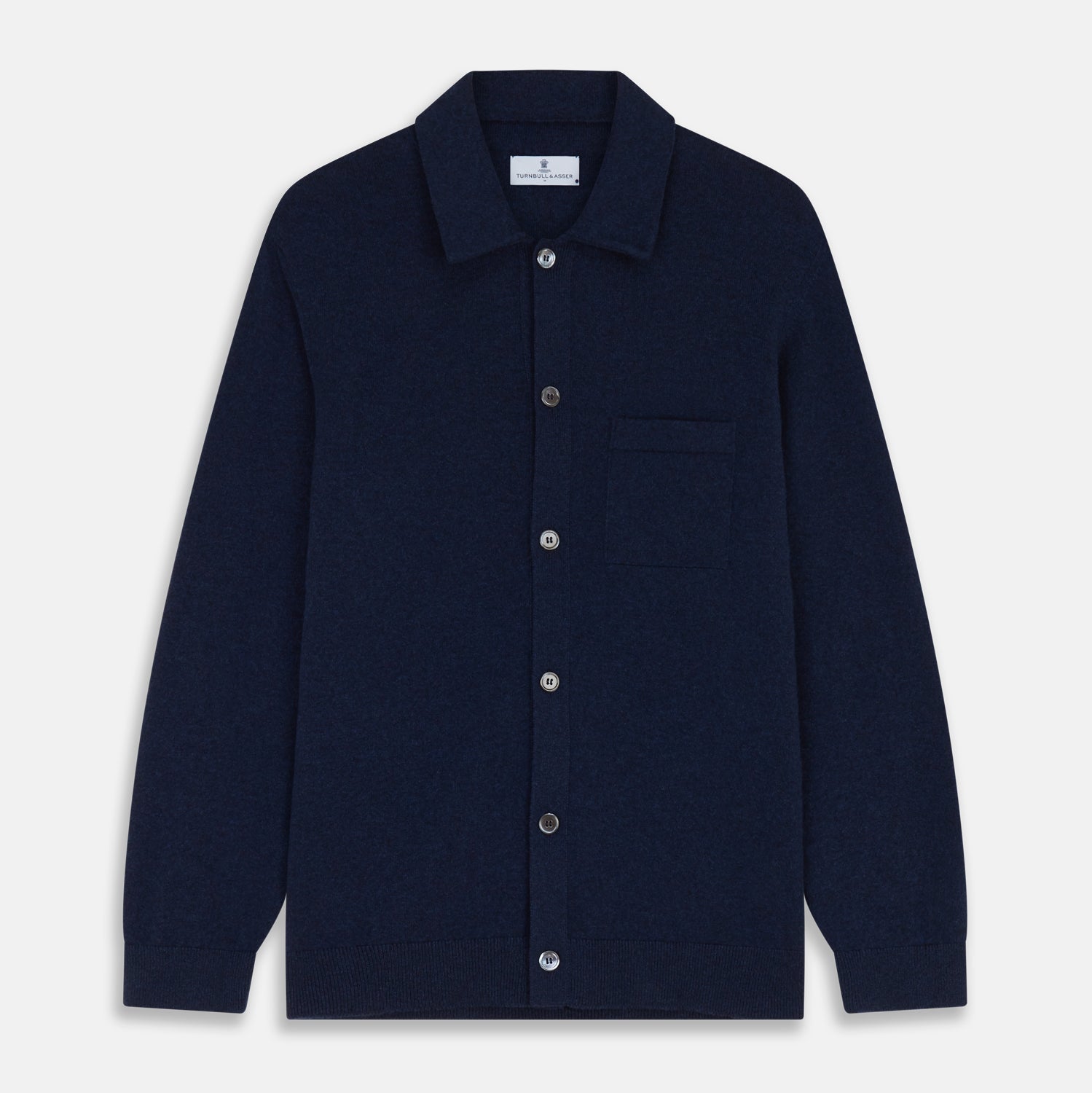 View 1 of product The Turnbull & Asser Navy Cashmere Duncan Knitted Shirt, a button-up with collar, long sleeves, chest pocket, and straight hem, is shown laid flat on a white background.