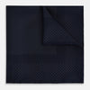 View 1 of product The Turnbull & Asser Navy and Charcoal Dot Silk Pocket Square features a subtle dotted pattern and a folded corner, shown on a white background.