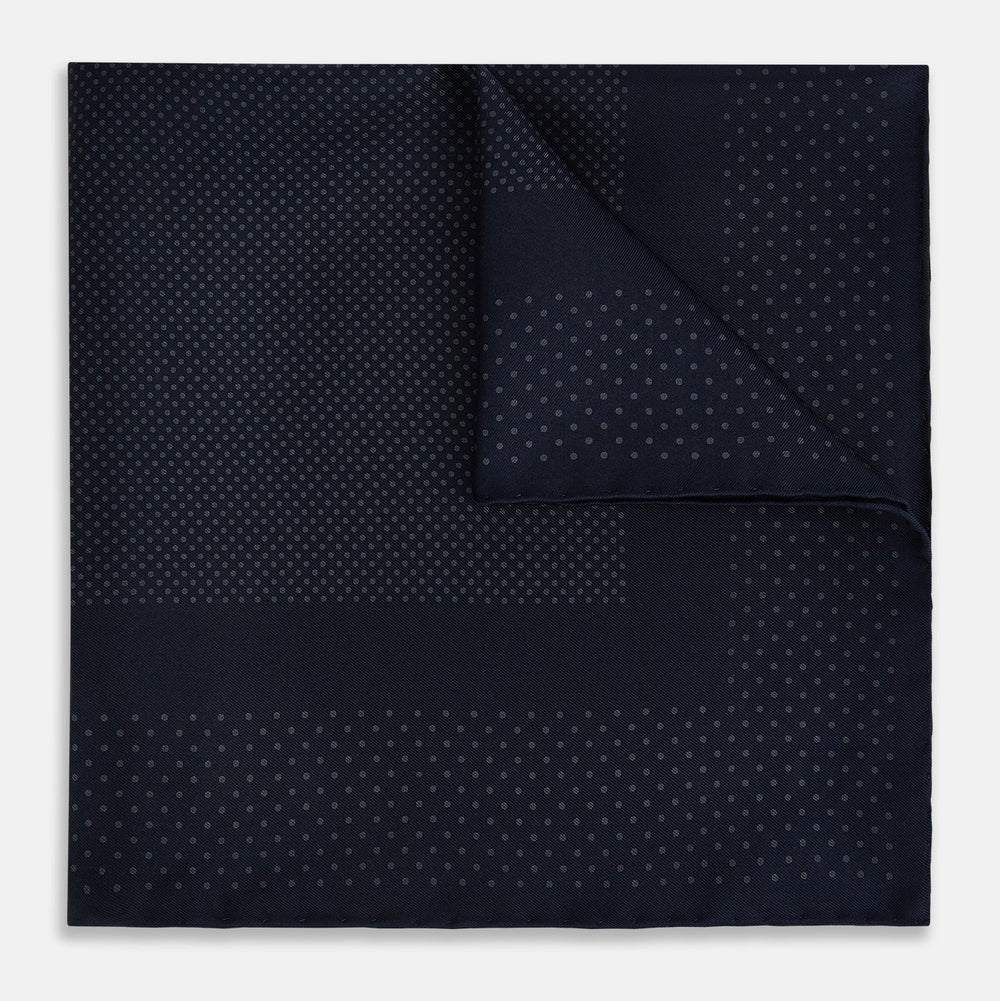 The Turnbull & Asser Navy and Charcoal Dot Silk Pocket Square features a subtle dotted pattern and a folded corner, shown on a white background.