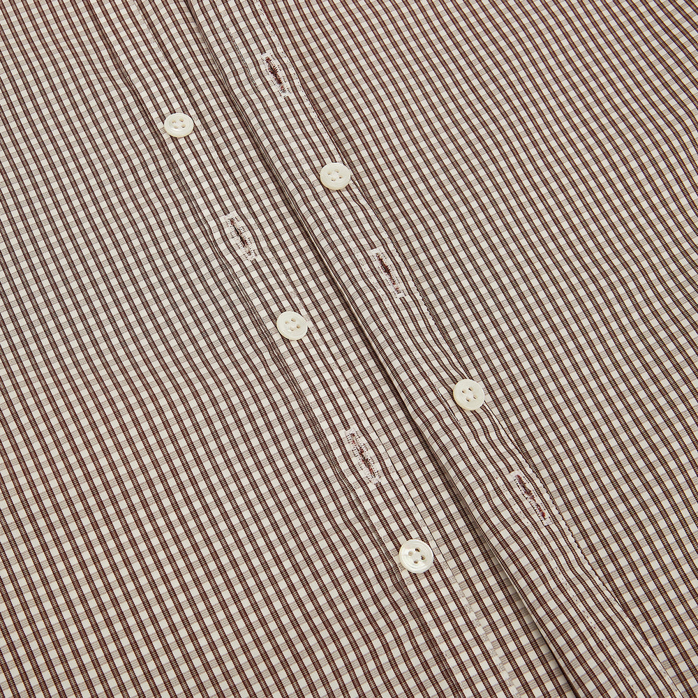 The Turnbull & Asser Burgundy Micro Check Westminster Shirt is a long-sleeved button-up with a classic collar and tailored fit, featuring a subtle micro check pattern, shown against a white background.