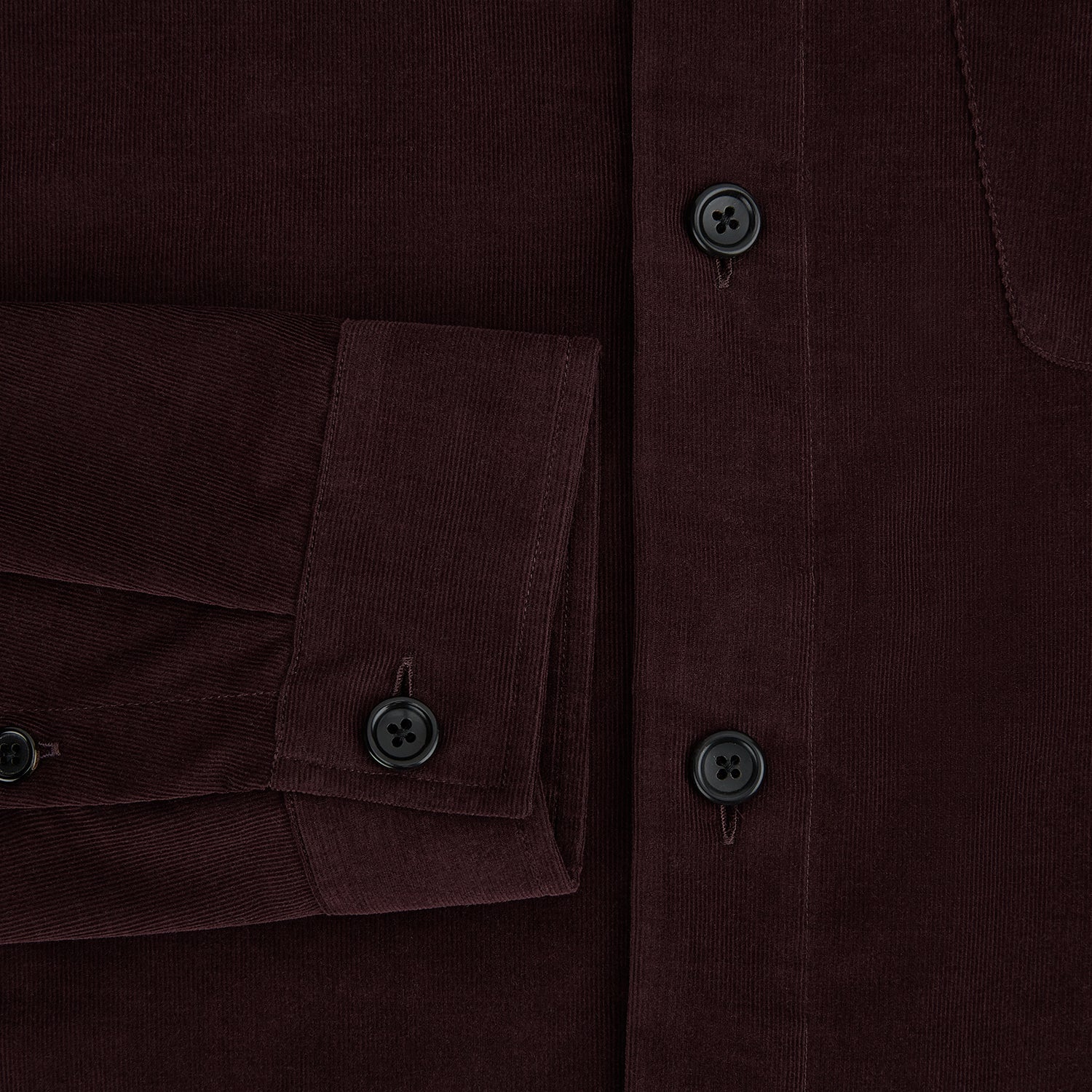 View 4 of product The Turnbull & Asser Burgundy Corduroy Hampstead Overshirt features long sleeves, a collar, a large left chest pocket, and two zippered side pockets, shown laid flat on a plain white background.