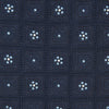 View 3 of product The Turnbull & Asser Jacquard Silk Circle Tie showcases a textured navy blue design with small white and light blue floral motifs—an essential accessory for refined attire.
