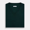 View 4 of product The Turnbull & Asser Petrol Green Merino V-Neck Jumper features long sleeves and ribbed cuffs and hem—an essential knitwear piece, shown against a white background.