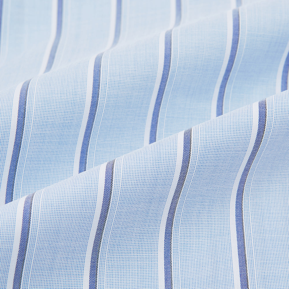 The Blue and Navy Multi-Stripe Westminster Shirt by Turnbull & Asser, featuring bold vertical stripes and a classic collar, exemplifies British craftsmanship and is shown laid flat on a white background.