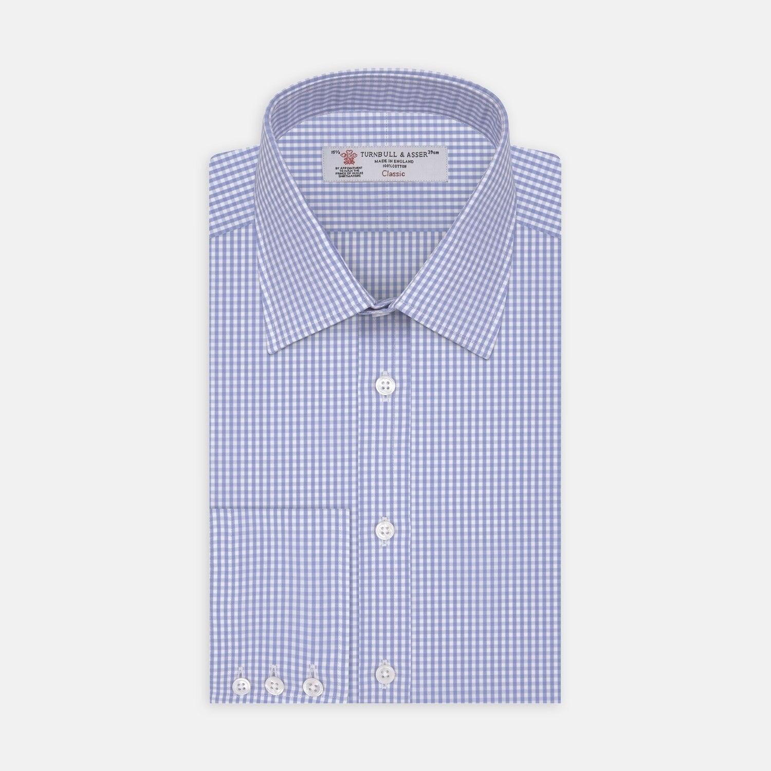 View 2 of product A circular swatch of Turnbull & Asser's Light Blue Gingham Check Cotton Fabric, featuring a simple light blue and white checkered pattern, is bordered by a thin gray outline on a white background.