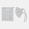 View 2 of product The Turnbull & Asser Check Blue Multi Commuter Mask features a blue plaid design, adjustable fabric ear loops tied in bows, and comes with 3 Viroformula™ filters. Laid flat on a white background.