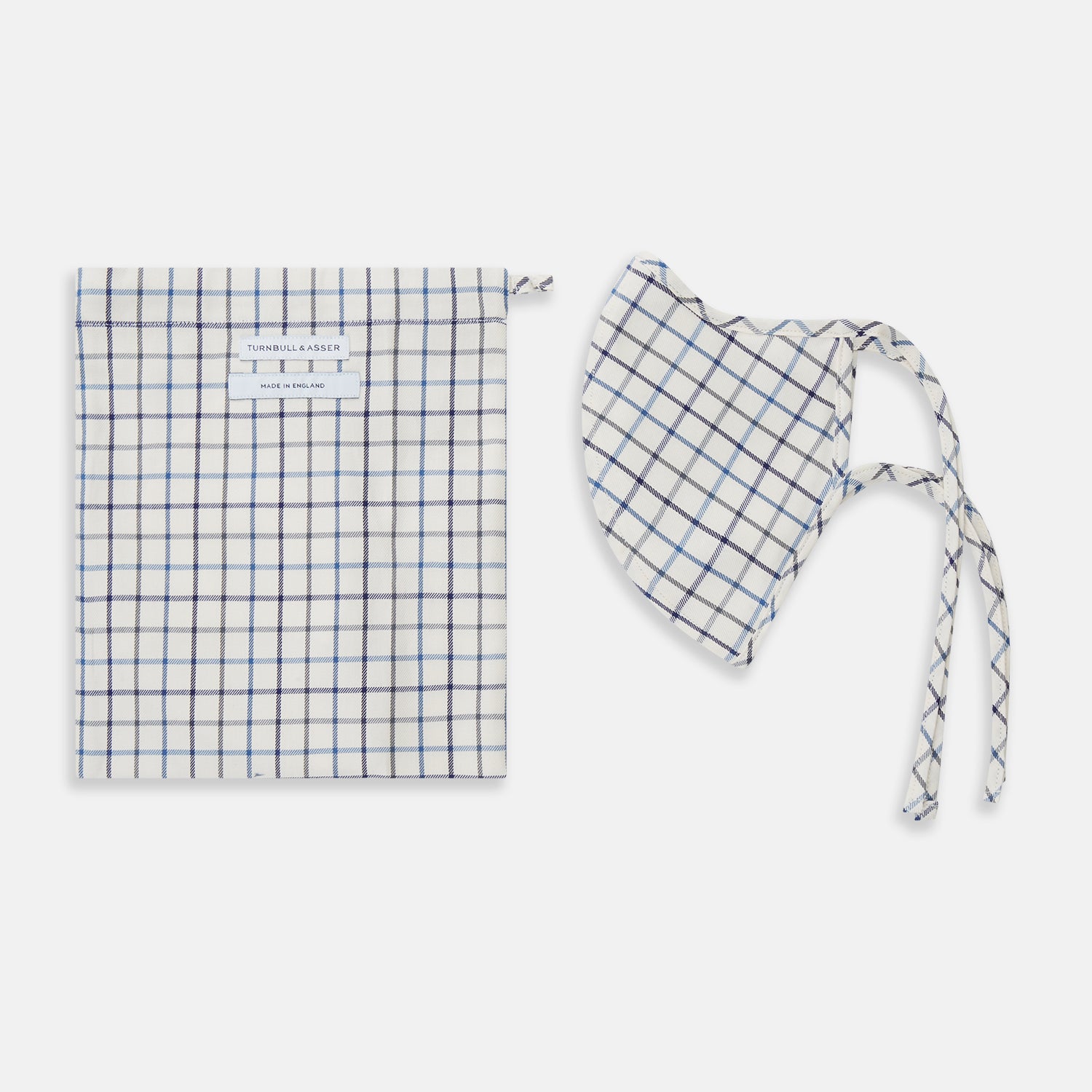 View 2 of product The Turnbull & Asser Check Blue Multi Commuter Mask features a blue plaid design, adjustable fabric ear loops tied in bows, and comes with 3 Viroformula™ filters. Laid flat on a white background.