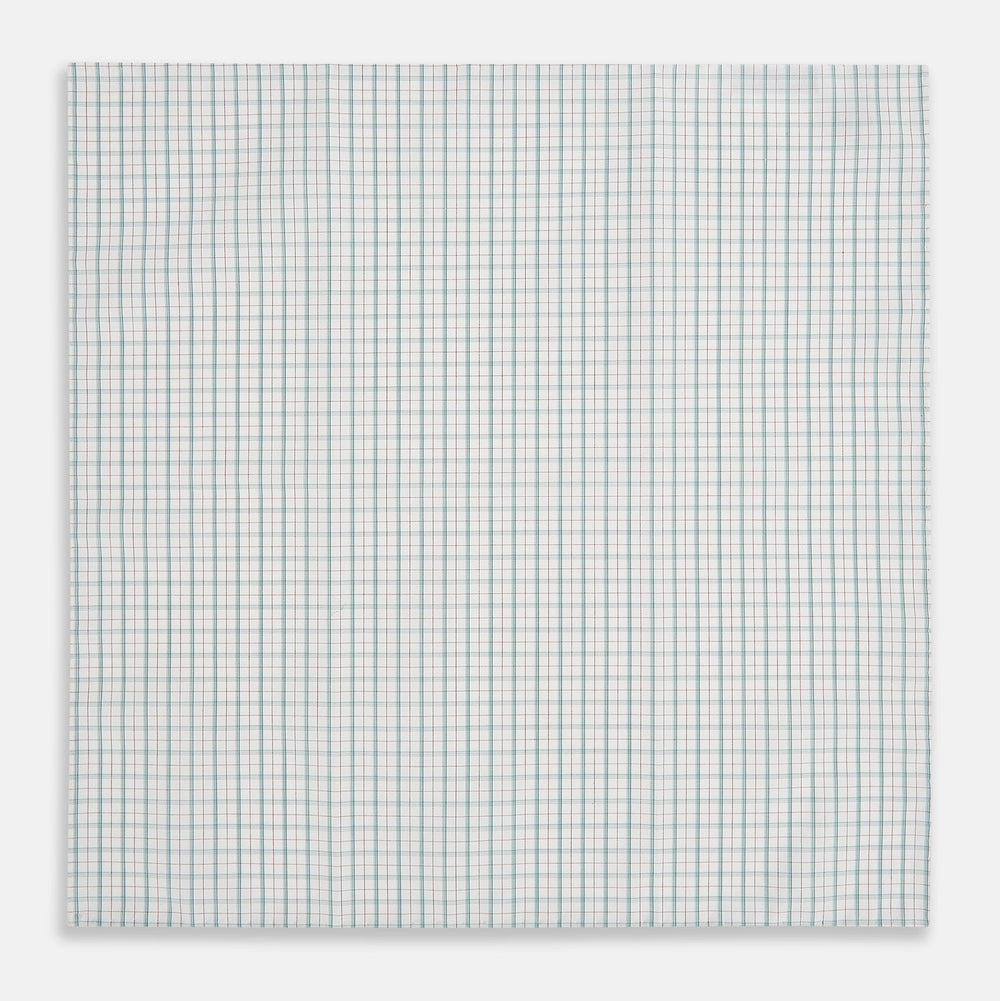 The Turnbull & Asser Green Multi Graph Check Hand-Rolled Handkerchief features a graph check pattern with thin colorful lines forming small squares, hand-rolled edges, and is laid flat against a white background.