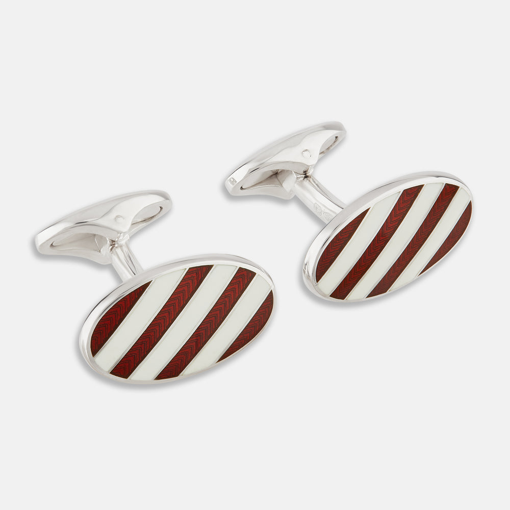 Turnbull & Asser's Burgundy and White Striped Oval Enamel Cufflinks feature a diagonal pattern in silver, embodying masculine elegance.