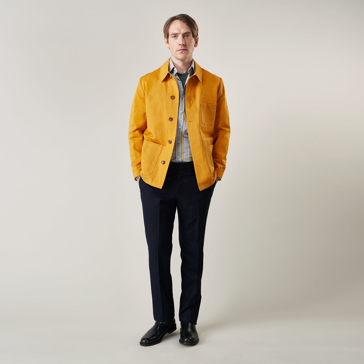 View 2 of product The Turnbull & Asser Ochre Cotton-Linen Remy Chore Jacket features a collar, long sleeves, brown front buttons, and three patch pockets, shown on a plain white background.