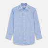 View 1 of product The Blue Prince of Wales Check Mayfair Shirt by Turnbull & Asser is a light blue formal long-sleeve shirt with a subtle check pattern, button-down front, and buttoned cuffs, shown laid flat on a white background.