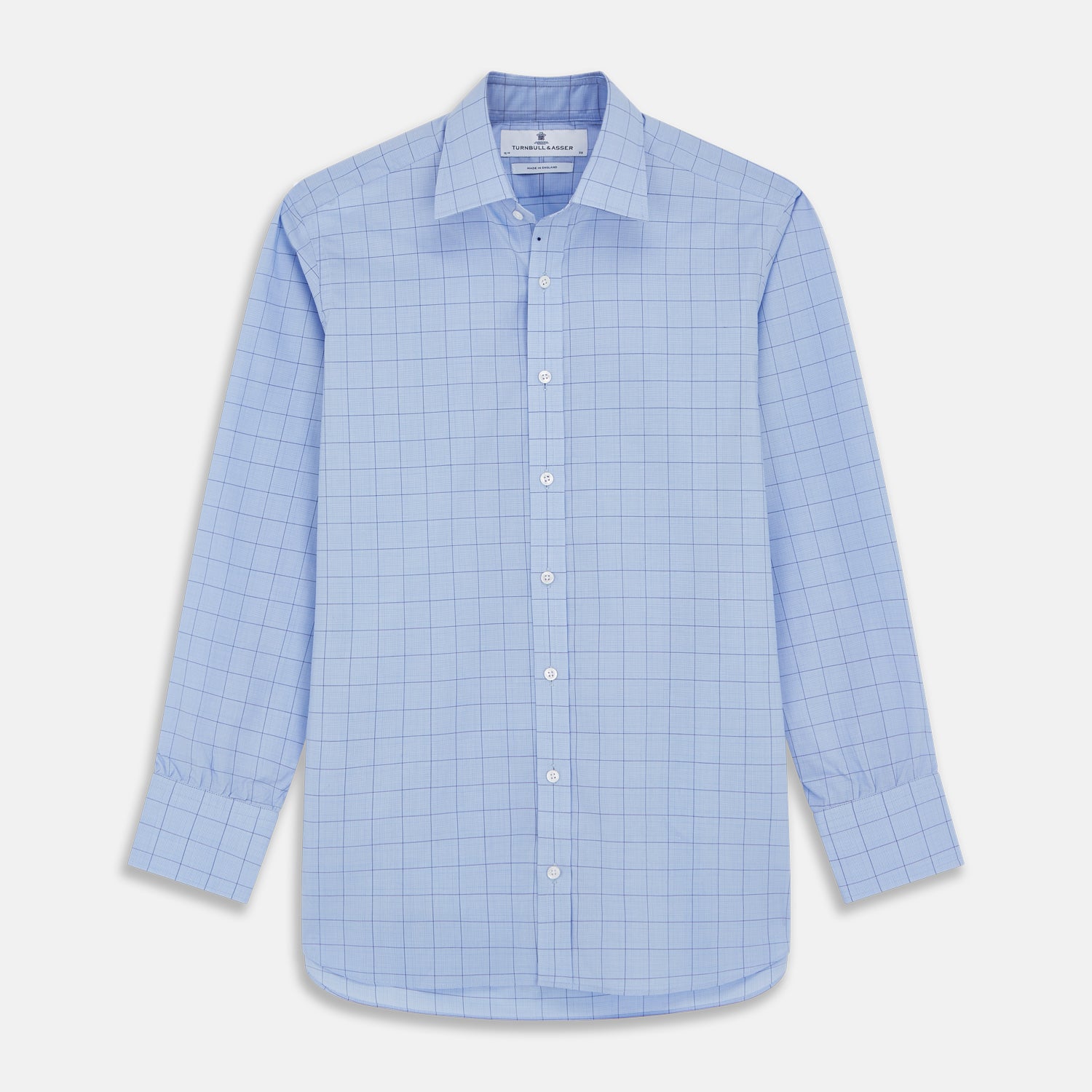 View 1 of product The Blue Prince of Wales Check Mayfair Shirt by Turnbull & Asser is a light blue formal long-sleeve shirt with a subtle check pattern, button-down front, and buttoned cuffs, shown laid flat on a white background.