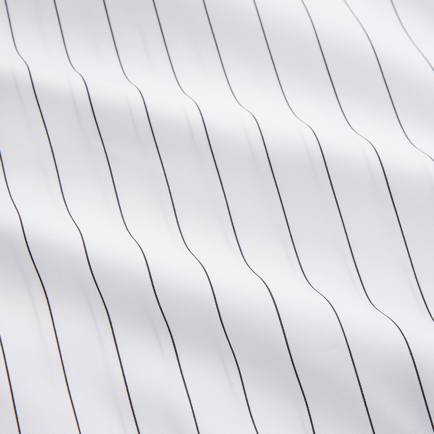 View 2 of product The Turnbull & Asser Black Fine Stripe Cotton Regular Fit Mayfair Shirt features a T&A collar, buttoned cuffs, and black fine stripes, displayed flat on a white background.