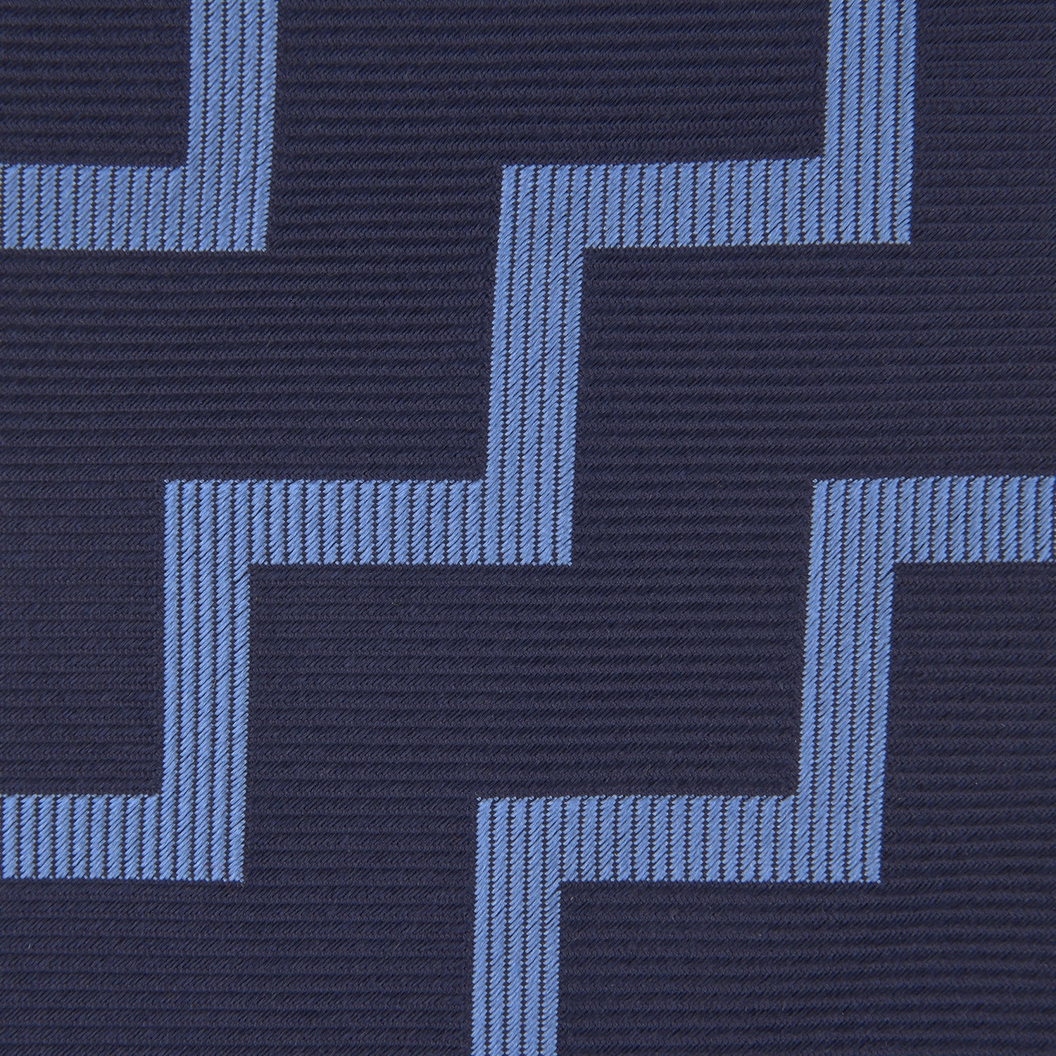 View 3 of product The Turnbull & Asser Navy and Light Blue Striped Zigzag Silk Tie features a striking zigzag pattern—a stylish accessory for the modern gentleman.