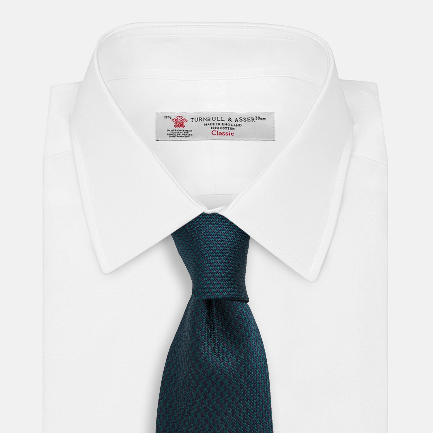 View 2 of product The Turnbull & Asser Navy Houndstooth Forest Green Tie is shown rolled up, featuring a subtle houndstooth pattern against a plain white background.