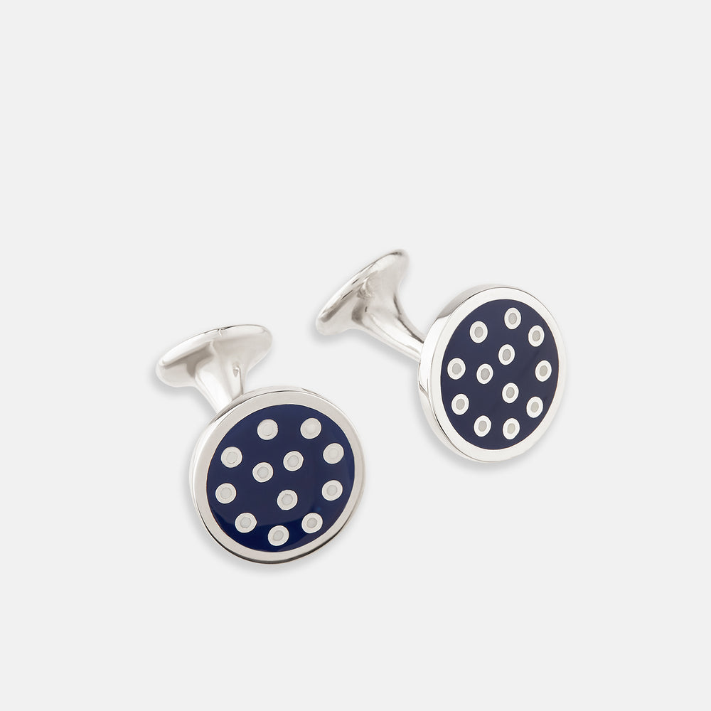 The Turnbull & Asser Navy Spotted Circle Enamel Cufflinks feature round faces with silver polka dots, offering a classic men's accessory in a striking navy design.
