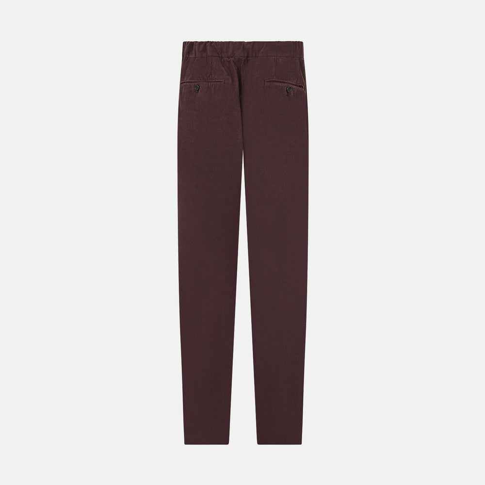 Turnbull & Asser Burgundy Corduroy Miles Trousers: high-waisted, straight-leg pants with an elasticated drawstring waist, shown on a white background.