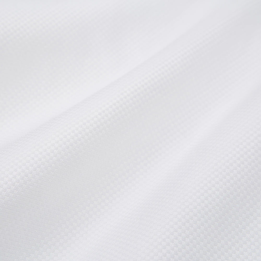 The Turnbull & Asser Casino Royale White Dress Shirt, as seen on James Bond, features a classic Bond collar, button-down front, and buttoned cuffs, shown on a white background.