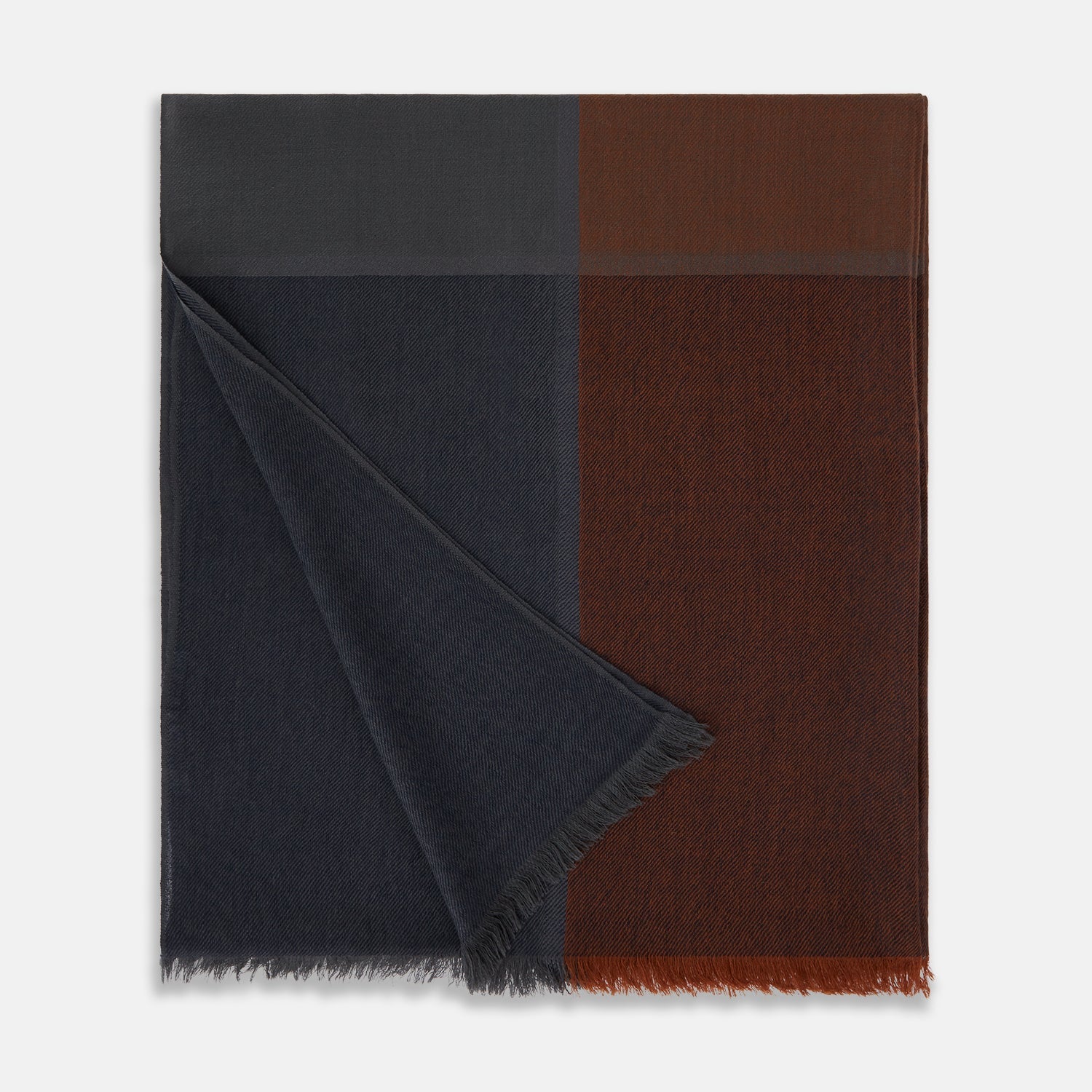 View 3 of product The Turnbull & Asser Brown and Navy Cashmere Scarf features a long, rectangular shape, color block design, soft texture, and lightly frayed edges, elegantly folded on a plain white background.