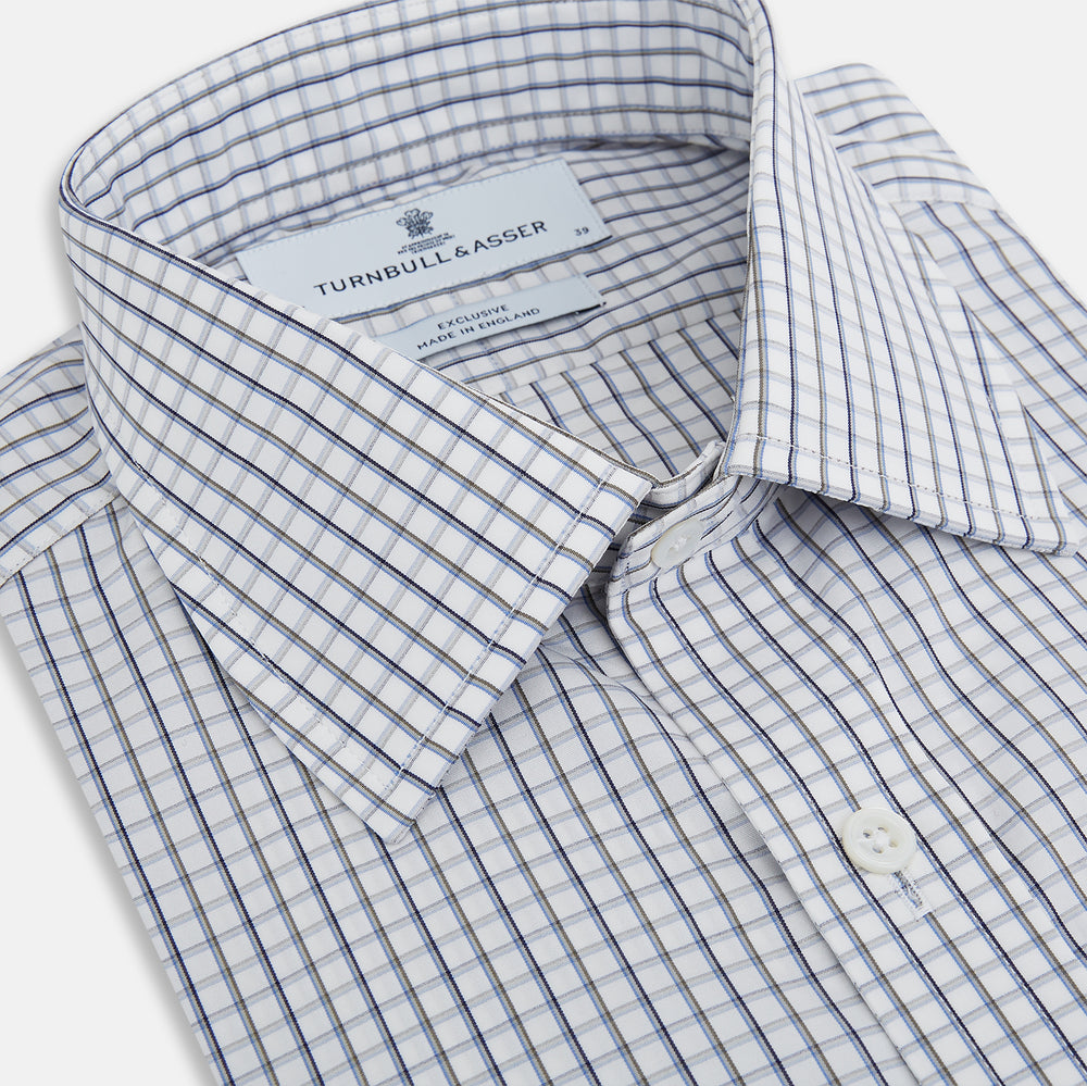 The Turnbull & Asser Blue and Coffee Tattersall Check Mayfair Shirt is a long-sleeved, button-up style made from Italian cotton, featuring a collar and buttoned cuffs, shown laid flat against a white background.